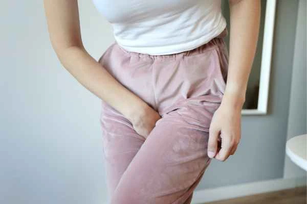 woman running for the toilet because of urinary incontinence Hockley
